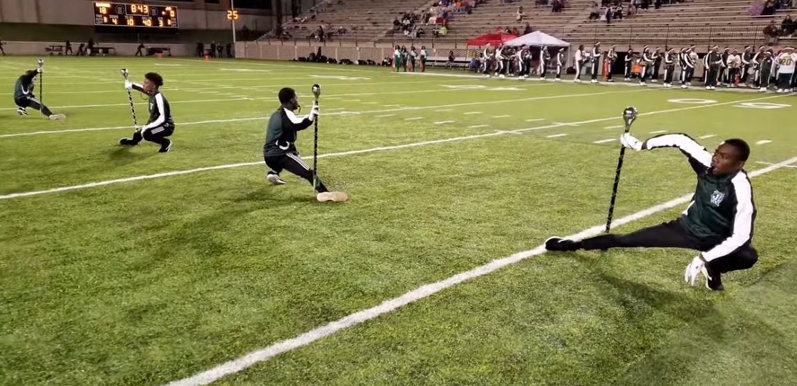 Marching band members fly onto field give a show so dynamic the crowd