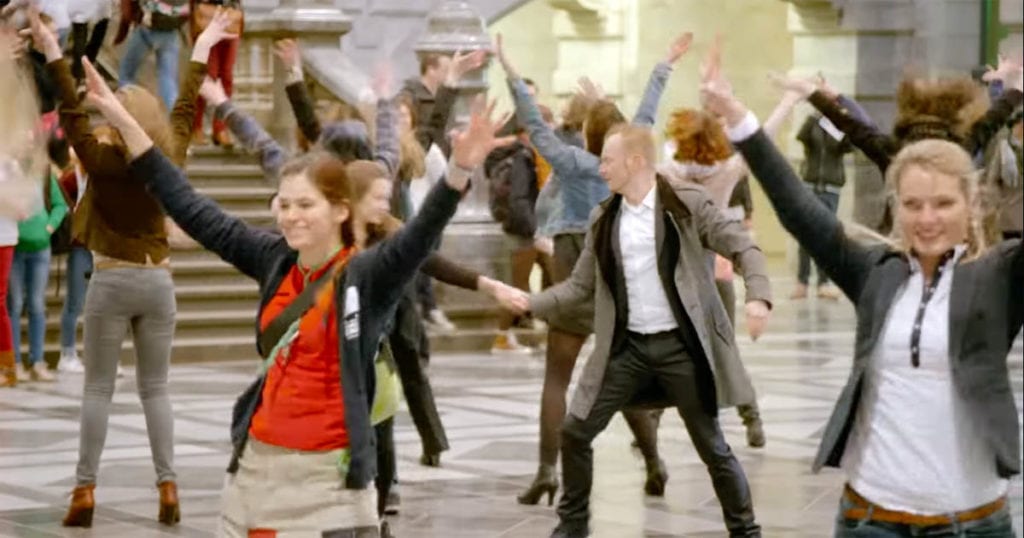 Crowd performs perfect Greasethemed flash mob in Belgian train station