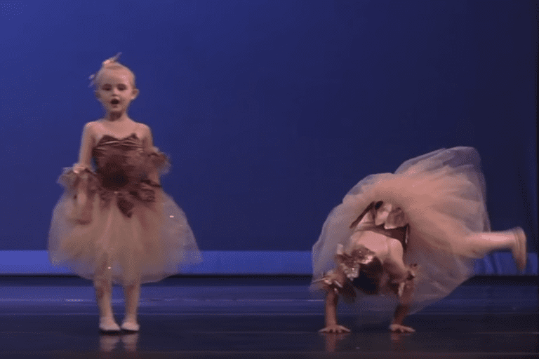 Little girl falls during recital and quickly improvises