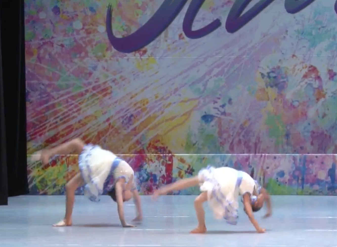 Tiny gymnasts win hearts performing acrobatic creepy doll dance