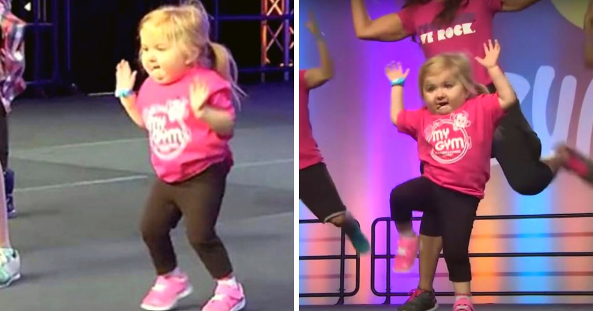 Adorable little girl springs on stage with Zumba dancers and promptly